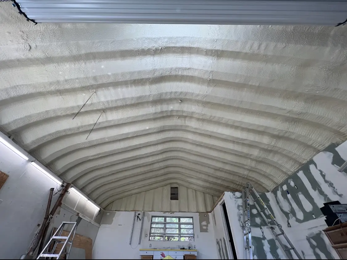 Spray polyurethane foam applied to the underside of a metal roof deck in Cheviot